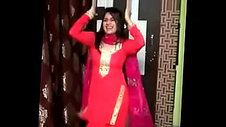 Young Muslim woman practices her mujra dance in front of the camera, showing her skills.