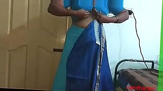 Desi Indian aunties of Tamil, Telugu, Kannada, Malayalam, and Kerala origin, as well as Hindi bhabhi, are featured in this video. Vanitha, a horny cheating wife, is seen wearing a saree that accentuates her big boobs and shaved pussy. The aunty is changing her dress, getting ready for a party, and making a video at the same time.