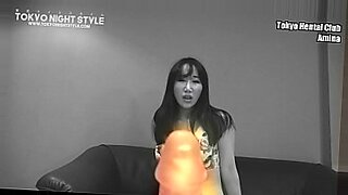 Japanese girl uses a vibrator to stimulate her pussy and moans with pleasure.