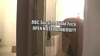 My husband takes me to a swinger hotel and I use a big black wood absorption fuck stick with the window shades open for voyeurs to watch!