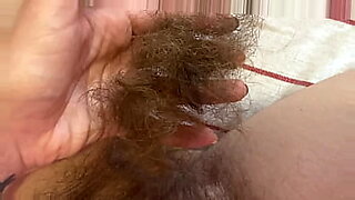 Close up of me shaving my long and bushy pussy hair, a rather unusual fetish.