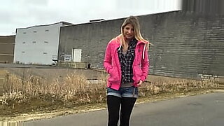 A young amateur gives a real outdoor blowjob in a parking lot.