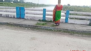 See an Indian village beauty in a green saree in action.