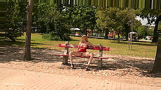 Freya in a crimson dress in the park flashing!